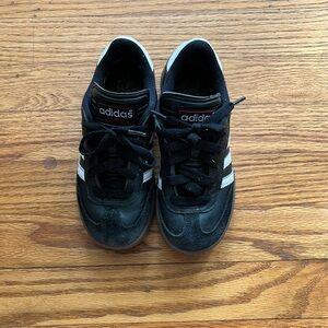 Kids size 13.5 black Sambas in good condition with some wear.
